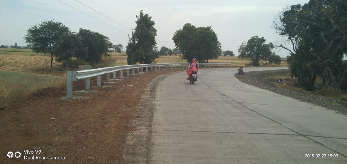 Providing and fixing of W type Metal crash barrier beam